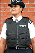 Policewoman wearing body armour