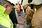 Firefighters examining evidence