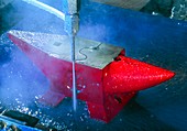 Waterjet cutting through a steel anvil