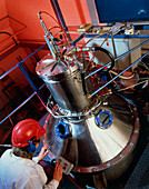 Researcher using a high-energy gas atomiser