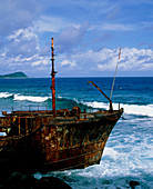 Rusting shipwreck on a sea coast