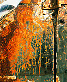View of rust on the door of an abandoned vehicle