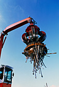Large electromagnet in use at a scrapyard