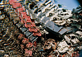 View of cars rusting in a scrap yard