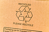 Recycling symbol on recycled cardboard