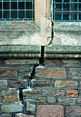 Brick wall and mortar of a church severely cracked