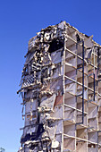 Residential tower block during demolition
