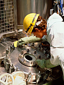 Worker observing a production process in a vessel