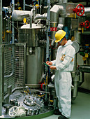 Chemical worker reading operating instructions