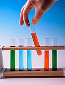 Rack of test tubes of various coloured solutions