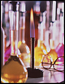 Lit bunsen burner with volumetric flasks