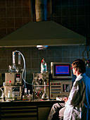 Scientist using HPLC equipment in a research lab