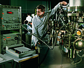 Scientist using a high resolution spectrometer