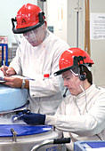 Scientists checking equipment