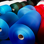 Rolls of coloured paper at a paper mill