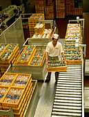 Man delivering bread to a bakery warehouse