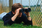 Man using pair of binoculars