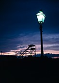 Lit gas lamp near a coal pit head