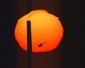 Helicopter passing in front of the Sun