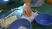 Doctor preparing surgical pads