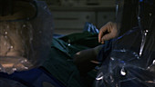 Dr preparing tube in operating theatre