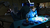 Doctor preparing surgical equipment