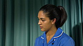 Nurse talking to patient in hospital bed