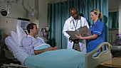 Doctor and nurse talking with patient