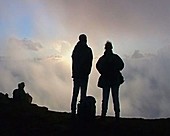 Silhouetted figures on Mt Etna