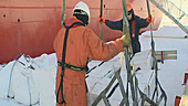 Loading ice core boxes, Antarctica