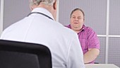 Doctor consulting with obese patient