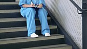 Female doctor on staircase