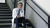 Male doctor on staircase