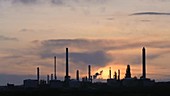 Oil refinery at sunset, timelapse
