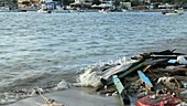 Wrecked boat debris on shore