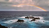 Rainbow over the sea, timelapse