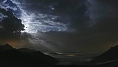 Moonset behind clouds, timelapse