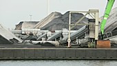 Wind turbines next to coal facility