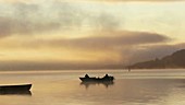 Boats on a lake at dawn