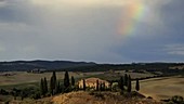 Rainbow over Tuscan landscape