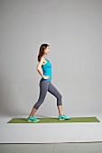Leg stretching exercise - Step 1: lunge forward