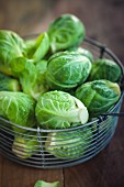 Fresh brussels sprouts in a wire basket