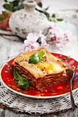 Piece of Lasagna on a White Plate; White Background