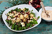 Spinach salad with roasted cauliflower and pomegranate seeds