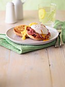Eggs Benedict with ham on a roll