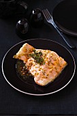 Fried salmon fillet with coarse mustard and thyme