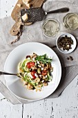 Raw courgette pasta with dried tomatoes and olives