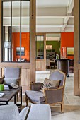 View from living room into colourful hallway and dining room