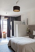 Bedroom and ensuite bathroom in shades of grey