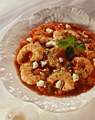 Prawns in tomato sauce with feta cheese and basil